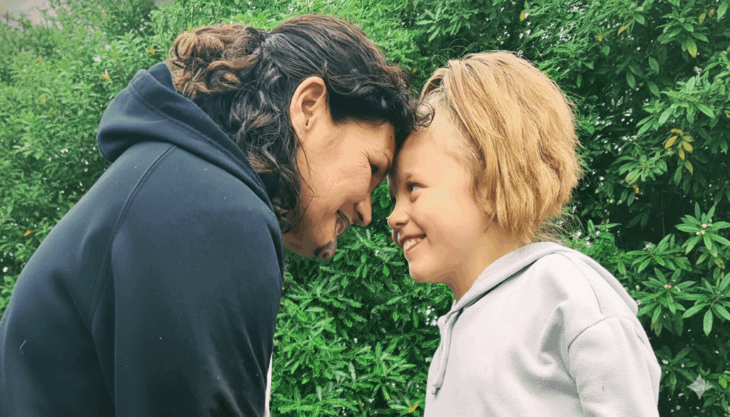 An older Māori woman with a moko kauae performing a hongi with a young girl with blonde hair